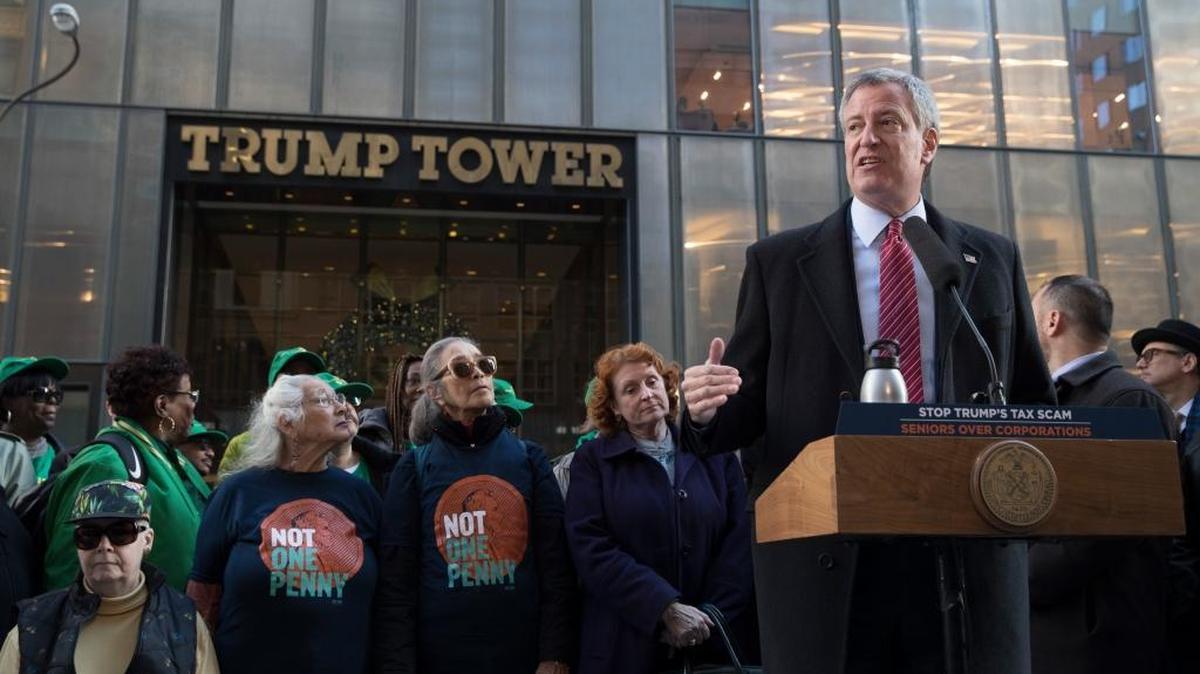 New York City Mayor Bill de Blasio speaks during a rally in opposition to the Republican tax plan outside Trump Tower Nov. 21 in New York. The estate tax alone will make Trump and his heirs even richer by about $1 billion, writes Elizabeth Sempadian.