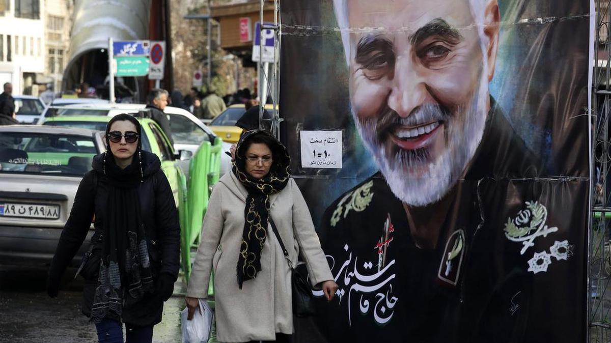 In this Jan. 9 photo, women in Tehran, Iran, walk past a banner of Iranian Revolutionary Guard Gen. Qassem Soleimani, who was killed in Iraq in a U.S. drone attack.
