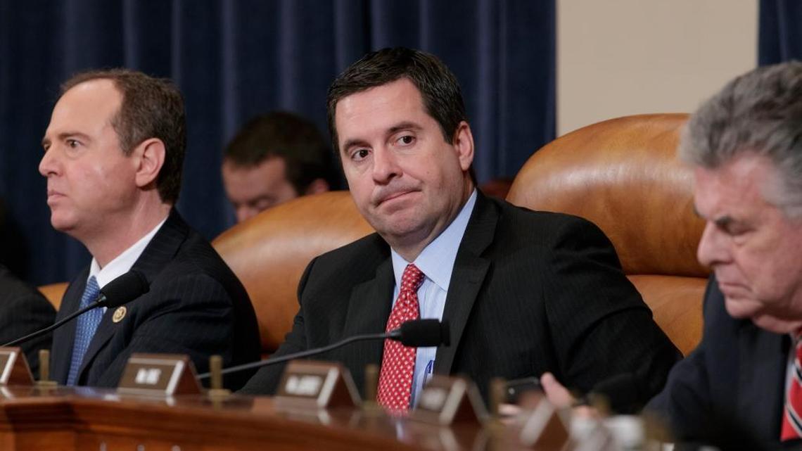 House Intelligence Committee Chairman Rep. Devin Nunes, R-Tulare, flanked by the committee's ranking member Rep. Adam Schiff, D-Calif., left, and Rep. Peter King, R-N.Y., listens on Capitol Hill in Washington during the committee's hearing on allegations of Russian interference in the 2016 U.S. presidential election.