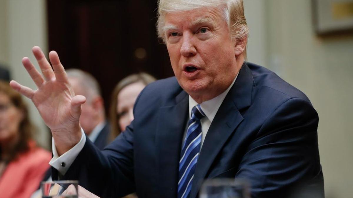 President Donald Trump speaks in the Roosevelt Room of the White House in Washington. /