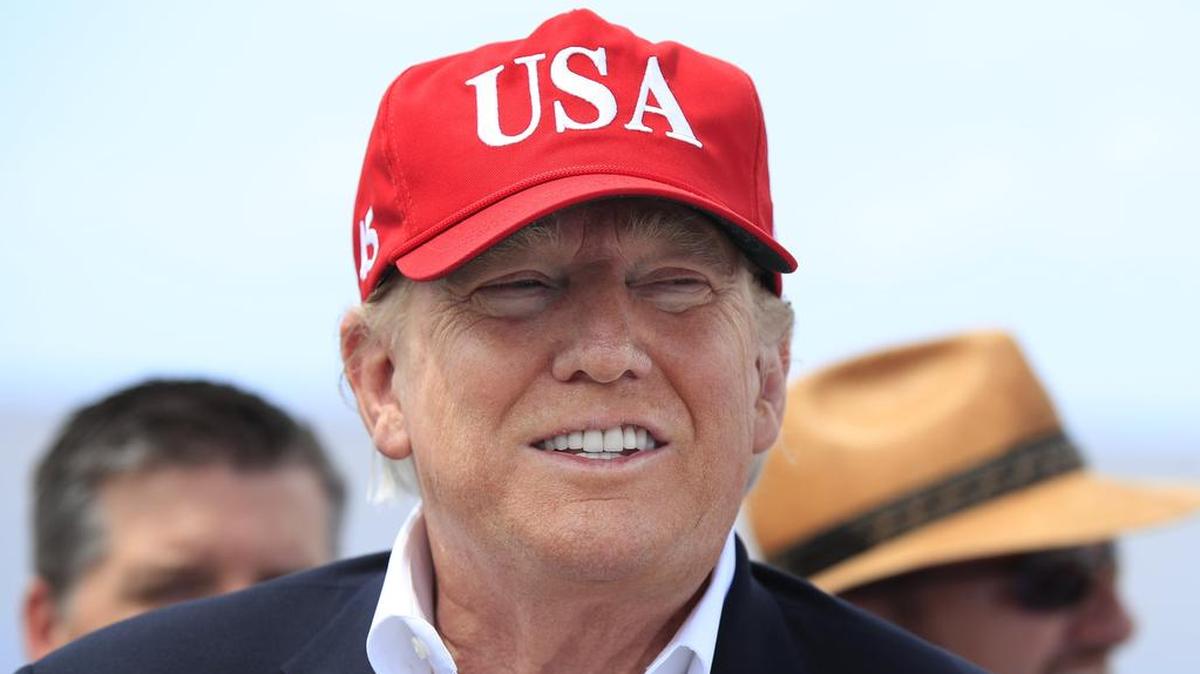 President Donald Trump speaks to reporters during a visit to Lake Okeechobee and Herbert Hoover Dike at Canal Point, Fla., Friday, March 29, 2019.