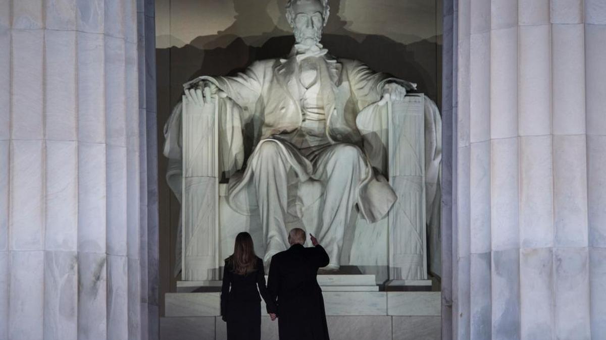 President-elect Donald Trump and his wife, Melania Trump, stand before the Lincoln Memorial during the "Make America Great Again" concert in 2017 as inauguration festivities got underway.