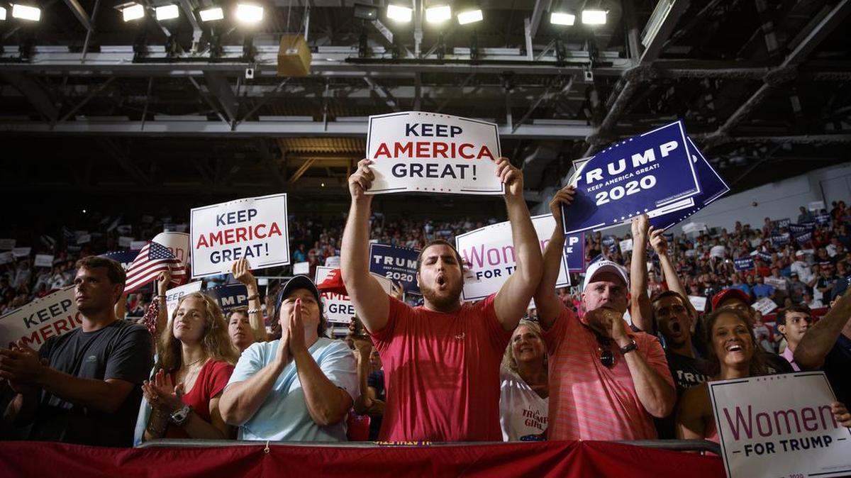 FILE -- Members of the audience cheer as President Donald Trump delivers remarks during a rally at East Carolina University in Greenville, N.C., July 17, 2019. President Donald Trump’s racially divisive attacks on Democrats of color might have been crippling for previous presidents, but many in the party are not convinced they will benefit in 2020. (Tom Brenner/The New York Times)