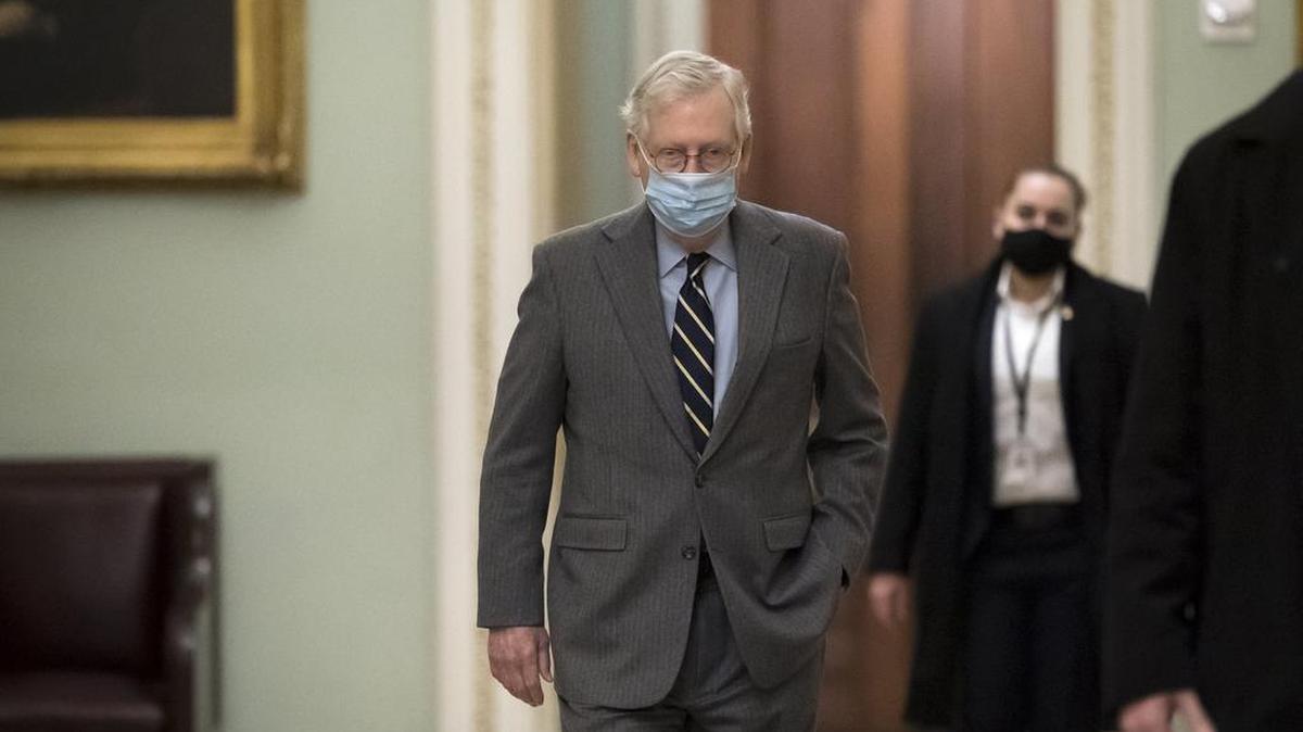 Senate Minority Leader Mitch McConnell, R-Ky., arrives at the Capitol in Washington, Tuesday, Jan. 26, 2021.