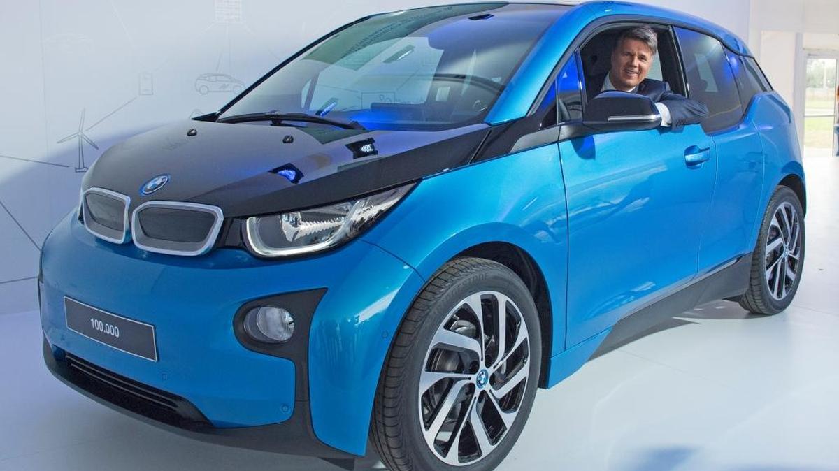 Harald Krueger, CEO of car manufacturer BMW, sits in a BMW i3 car after after it left the assembly line during the production anniversary of the 100,000th electric car at the plant of German luxury automaker BMW AG in Leipzig, Germany, Thursday.
