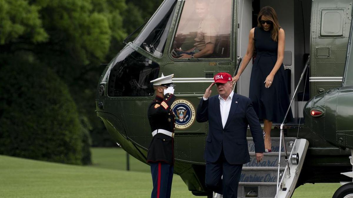 President Donald Trump and first lady Melania Trump arrive on Marine One at the White House on Friday, June 7. President Trump on Monday defended his administration’s decision to threaten a number of trading partners like Mexico with tariffs, calling tariffs a “beautiful thing” and asserting that a trade deal with China was close because of his aggressive policies.