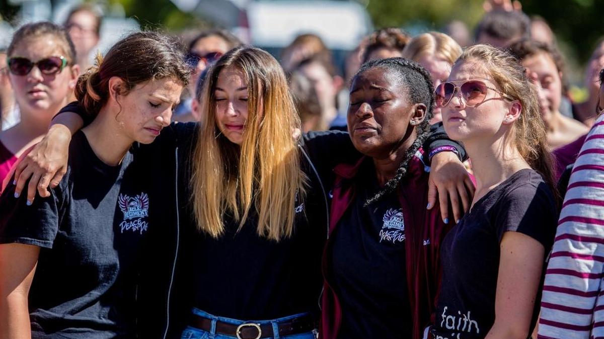 Students attend a prayer service at Parkridge Church in Coral Springs, Fla., a day after a mass shooting occurred at the nearby Marjory Stoneman Douglas High School, Feb. 15, 2018.