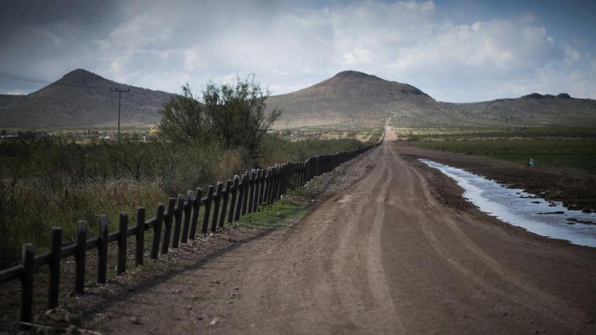 This Oct. 30, 2018 photo shows the international border between Mexico, left, and New Mexico of the U.S., three miles south of Columbus, N.M. New Mexico Gov. Michelle Lujan Grisham ordered the withdrawal of the majority of the state’s National Guard troops from the U.S. border with Mexico on Tuesday in a move that challenges President Donald Trump’s description of a security crisis.
