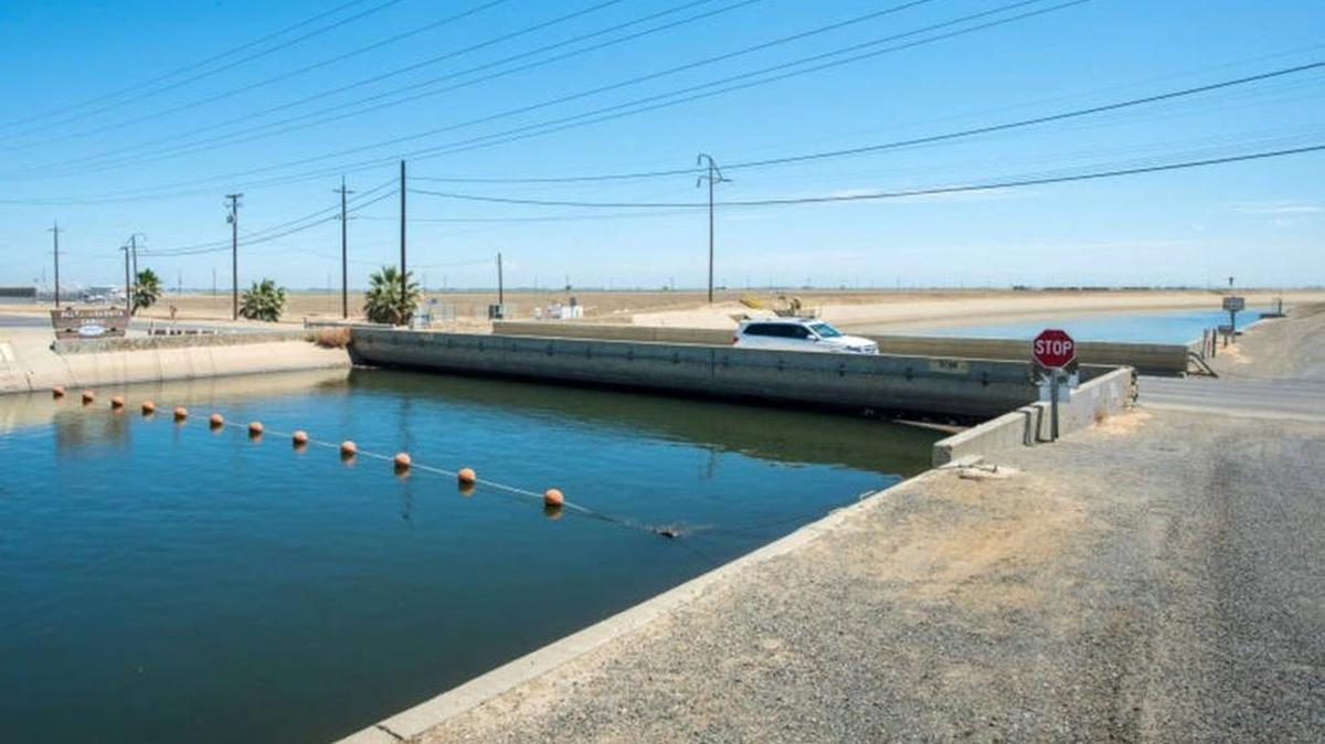 Land sank so much along the Delta-Mendota Canal that this bridge near Russell and Althea avenues in northwest Fresno County, once well above the water, now nearly touches it. Land subsidence is caused by massive groundwater pumping.