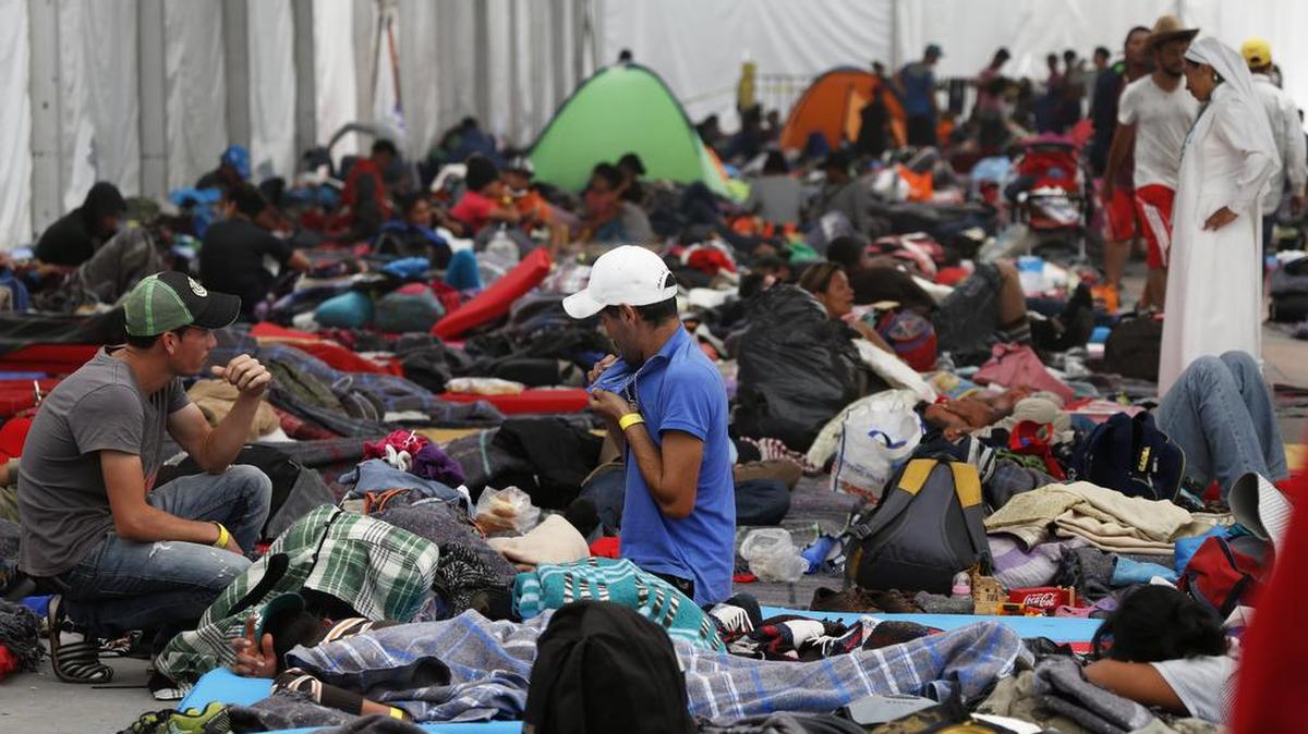 Central American migrants settle in a shelter at the Jesus Martinez stadium in Mexico City, Tuesday, Nov. 6, 2018. Humanitarian aid converged around the stadium in Mexico City, where thousands of Central American migrants winding their way toward the United States were resting after an arduous trek that has taken them through three countries in three weeks.
