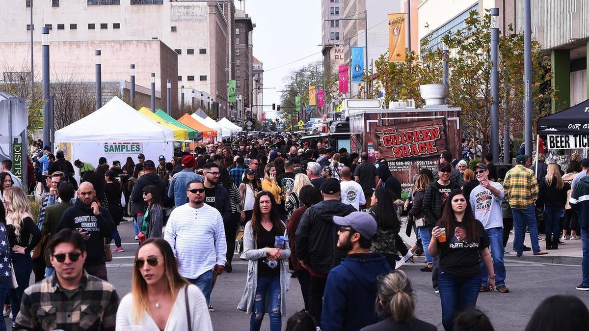 Thousands walk Fulton Street sampling food trucks, tasting craft beer, listening to live music and visiting pop-up shops at FresYes Fest Saturday, March 23, 2019 in downtown Fresno.