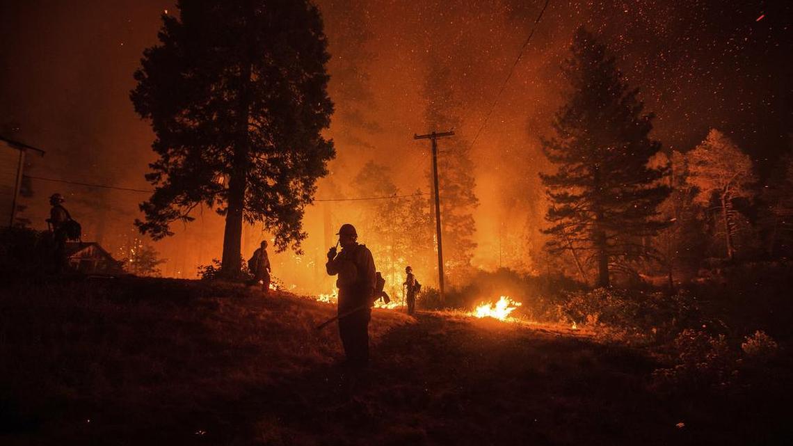 Firefighters monitor a backfire while battling the Delta Fire in the Shasta-Trinity National Forest in September.