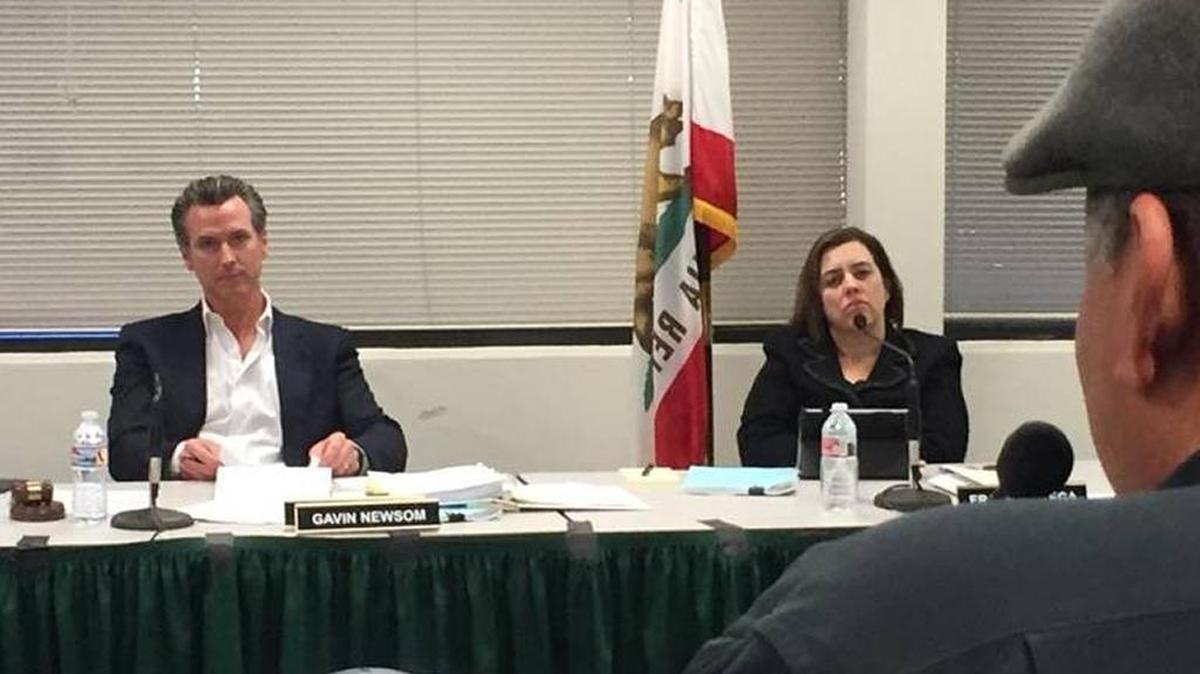 Lt. Gov. Gavin Newsom, left, listens as Rey León of Huron speaks in favor of a public access route to the San Joaquin River on Nov. 29 at a meeting of the California State Lands Commission in Fresno.