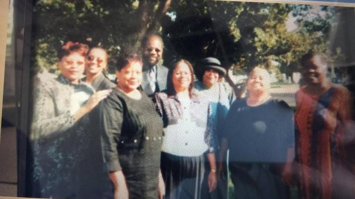 JePahl White uses this photo to illustrate what happened to his family after they moved to west Fresno decades ago. Only three people in the photo are still living. From left, they are: Aunt Julie Griffin (living, hypertension), aunt Terry Cook (deceased, 48, breast cancer), aunt Shelly Cook (living, blind, hypertension, diabetic), father Paul White (57, deceased, kidney failure, cancer), cousin Jan Jones (61, deceased, misdiagnosed bone cancer), mother Sheila White (living, diabetes, lupus), aunt Wilhelmine Cook (50, deceased, colon cancer), and aunt Thomasee Stroud, (49, deceased, kidney failure, heart failure).