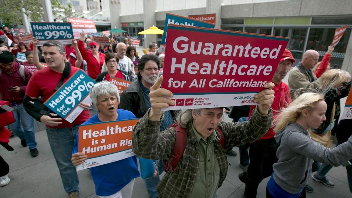 In this April 26, 2017 photo supporters of single-payer health care march to the Capitol in Sacramento.