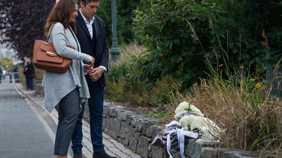 Guillermo Banchini, who survived an attack on this same bike path, stands with Mariana Dagatti, wife of Martin Marro of Argentina who is still hospitalized during a tribute Monday for five fellow citizens from Argentina who were killed Oct. 31, in New York.