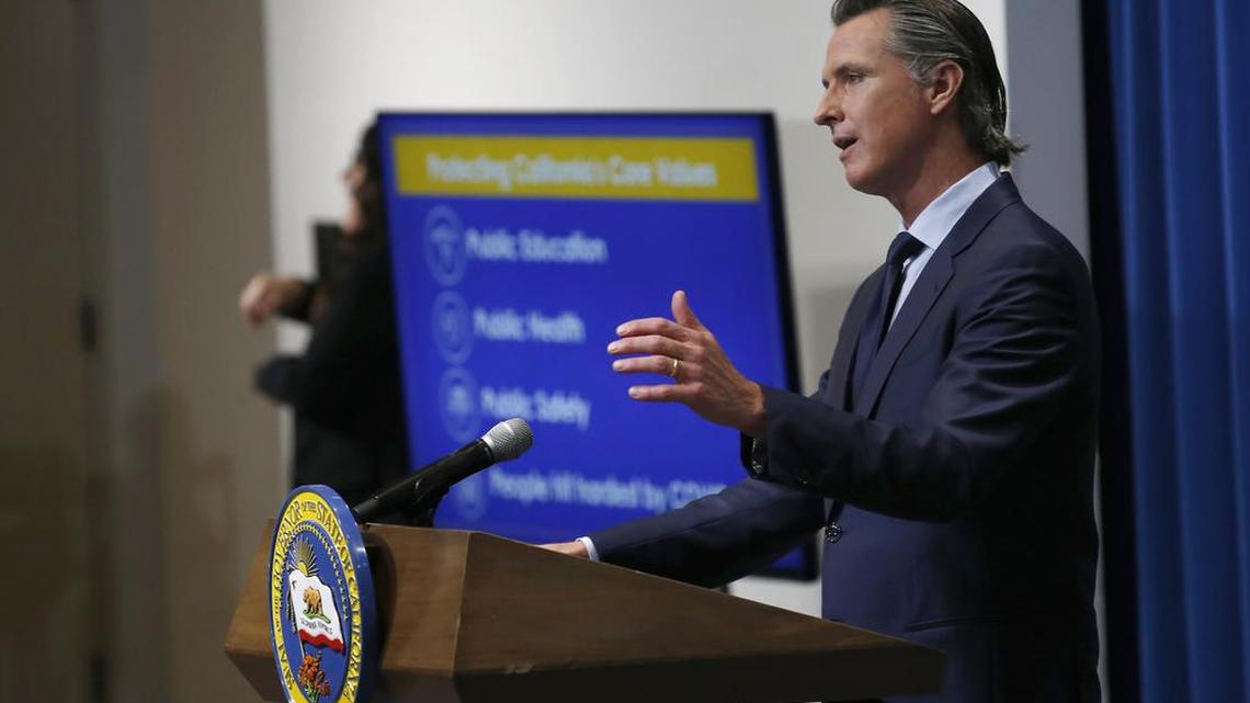 FILE - In this May 14, 2020, file photo, California Gov. Gavin Newsom discusses his revised 2020-2021 state budget during a news conference in Sacramento, Calif. Newsom and some of the state’s legislative leaders were among the millions to score federal loans aimed to keep small businesses afloat during the pandemic A Northern California-based winery and hospitality company, PlumpJack, founded by Newsom received a loan worth $150,000 to $350,000 from the Paycheck Protection Program, a national rescue package aimed to help small businesses during the pandemic, according to records released on Monday, July 6, 2020. (AP Photo/Rich Pedroncelli, Pool)