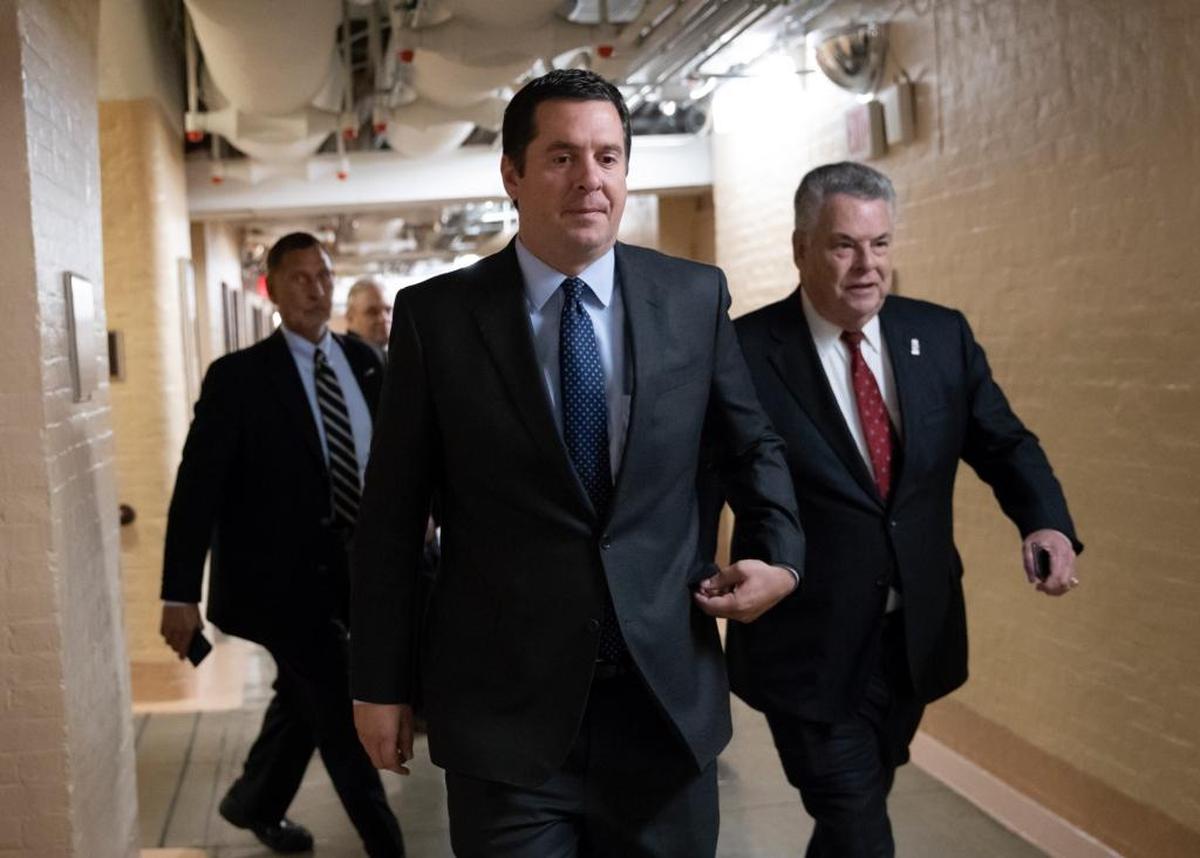 In this Feb. 6, 2018, photo, House Intelligence Committee Chairman Devin Nunes, R-Tulare, walks with Rep. Peter King, R-N.Y., also a member of the Intelligence Committee, at the Capitol in Washington.