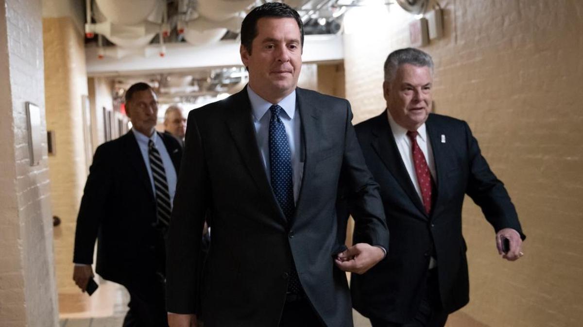 In this Feb. 6, 2018, photo, House Intelligence Committee Chairman Devin Nunes, R-Tulare, walks with Rep. Peter King, R-N.Y., also a member of the Intelligence Committee, at the Capitol in Washington.
