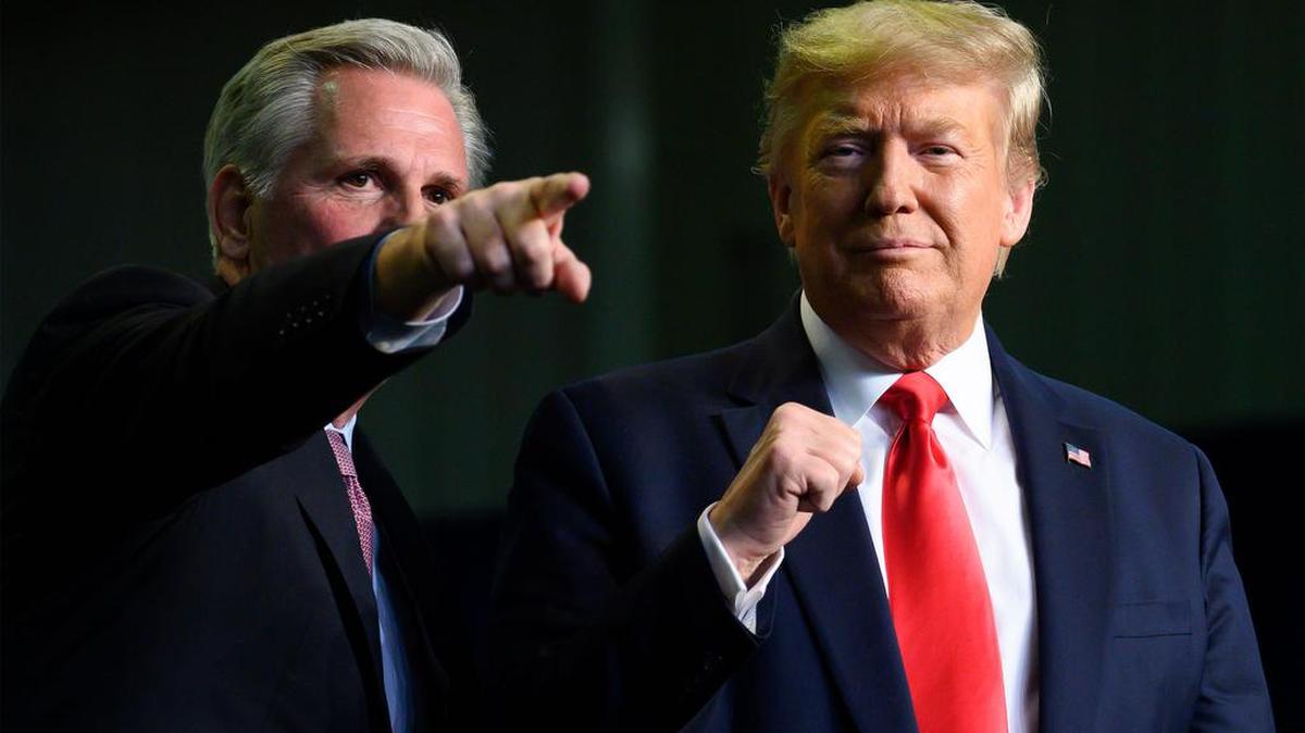 Then President Donald Trump, right, gestures next to U.S. Rep. Kevin McCarthy as they deliver remarks on California water accessibility in Bakersfield on Feb. 19, 2020.