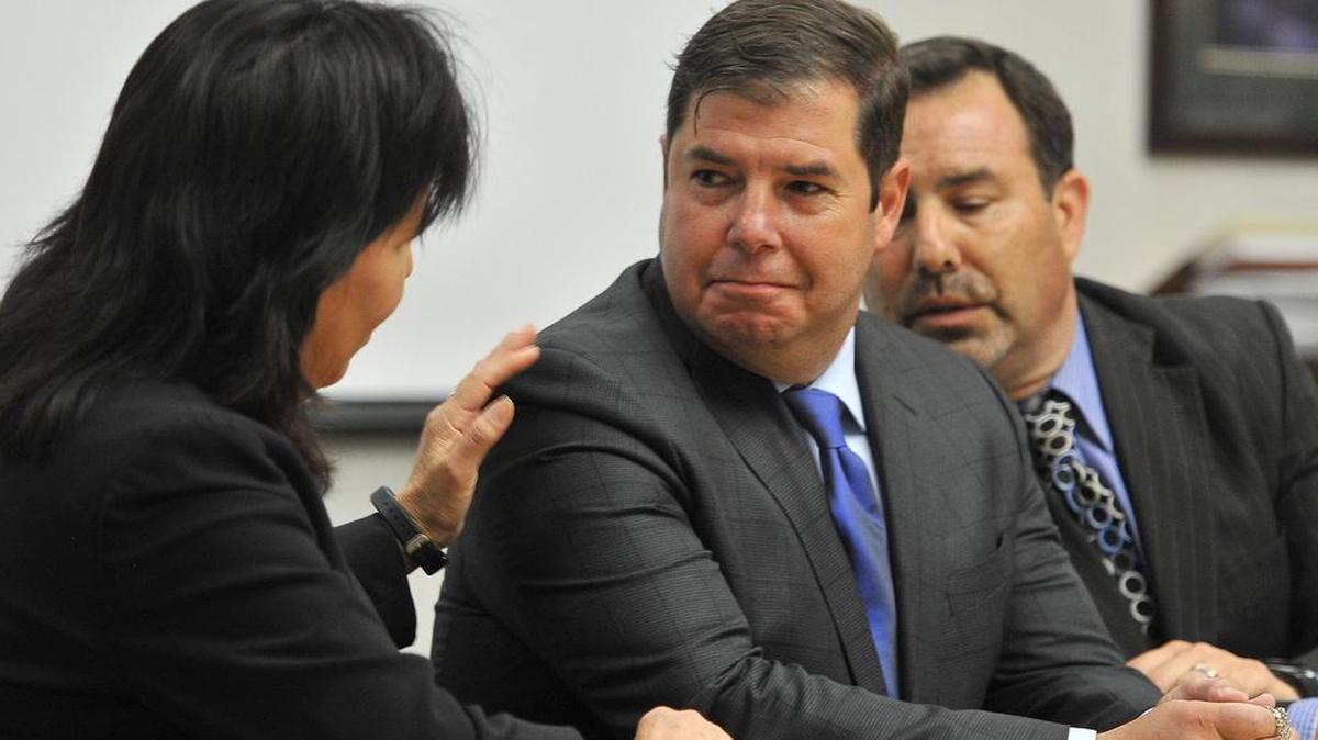 Clutching his rosary, Assemblyman Joaquin Arambula is congratulated by defense attorney Margarita Martinez-Baly, left, after the not-guilty verdict was read in court at the conclusion of his misdemeanor child abuse trial, in Superior Court, Thursday, May 16, 2019.