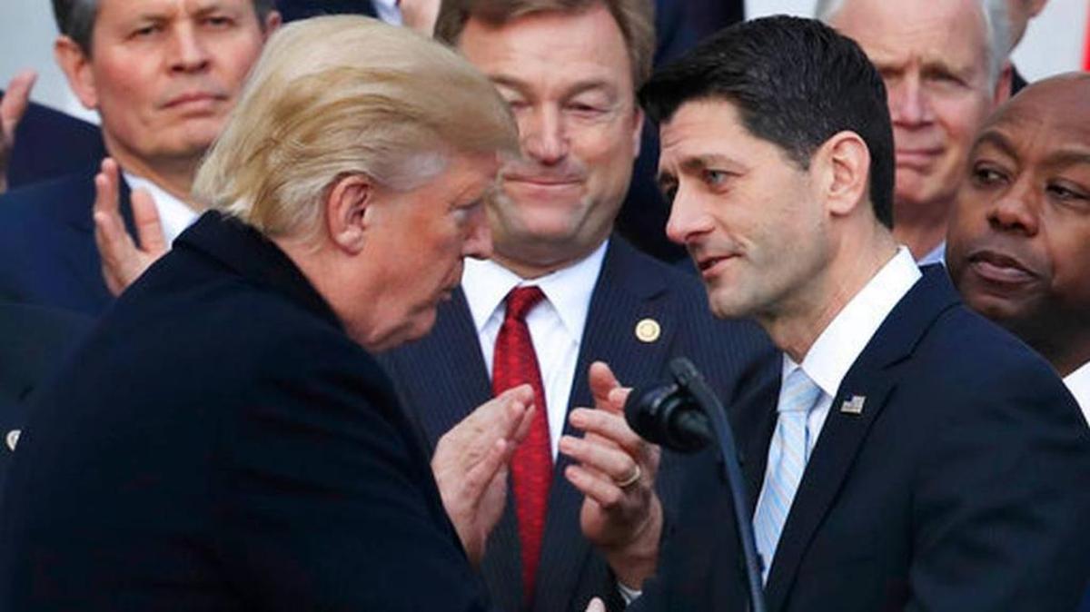 President Donald Trump shakes hands with House Speaker Paul Ryan of Wis., during an event to acknowledge the final passage of tax overhaul legislation by Congress on the South Lawn of White House in Washington, Dec. 20.