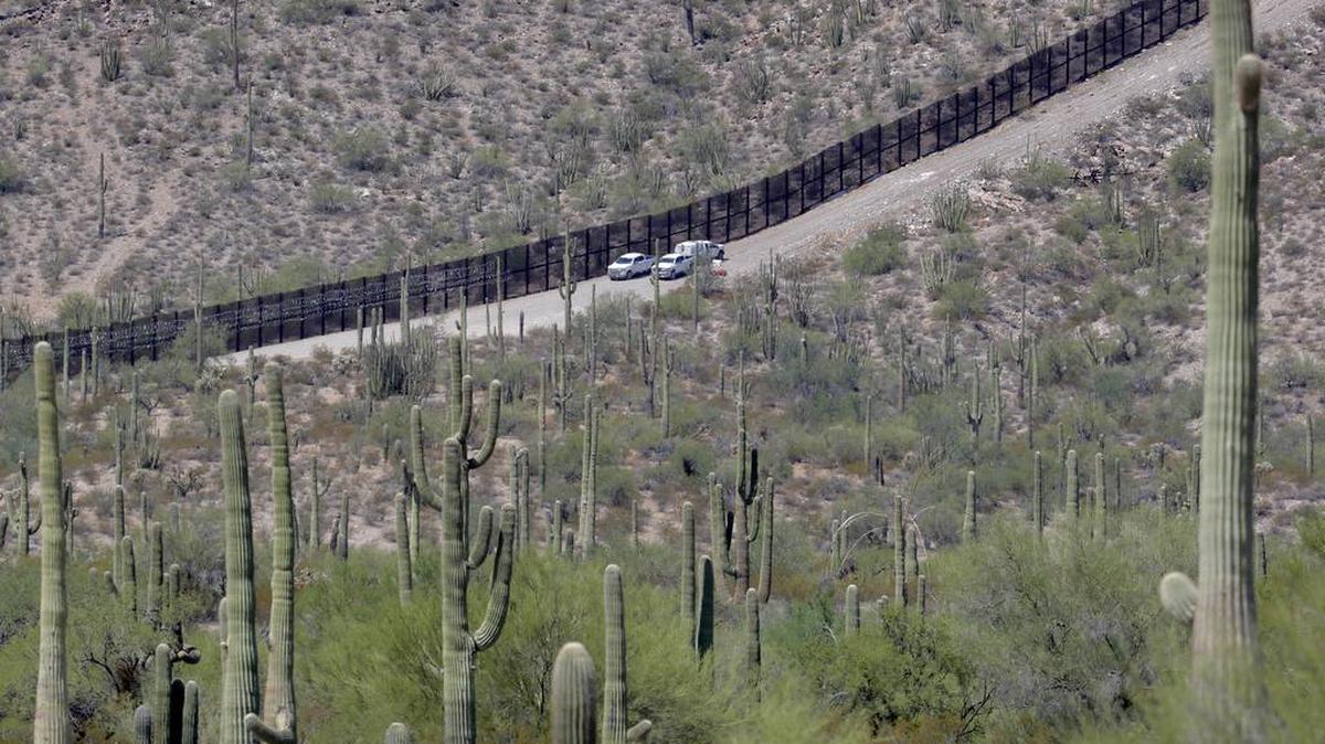 U.S. Customs and Patrol Patrol agents sit along a section of the international border wall that runs through Organ Pipe National Monument, Thursday, Aug. 22, 2019 in Lukeville, Ariz. Construction on a two-mile portion of replacement fencing funded by President Trump’s national emergency declaration has begun in an area near the official border crossing that runs through Organ Pipe.