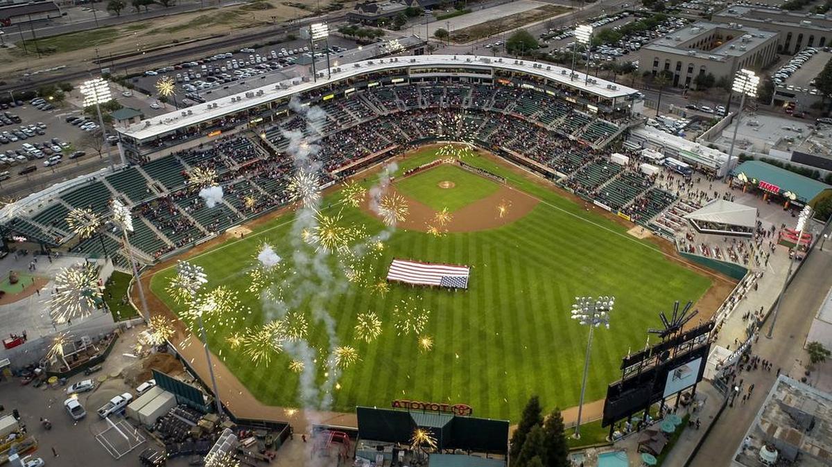 Fireworks explode above Chukchansi Park during the playing of the national anthem on the Fresno Grizzlies 2019 opening night.