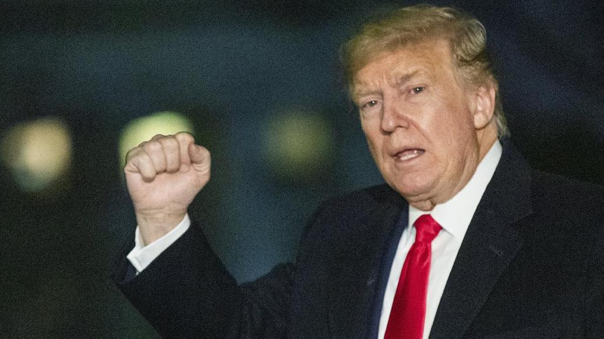 President Donald Trump gestures upon arrival at the White House, Wednesday, Jan. 22, 2020, in Washington, from the World Economic Forum in Davos, Switzerland.