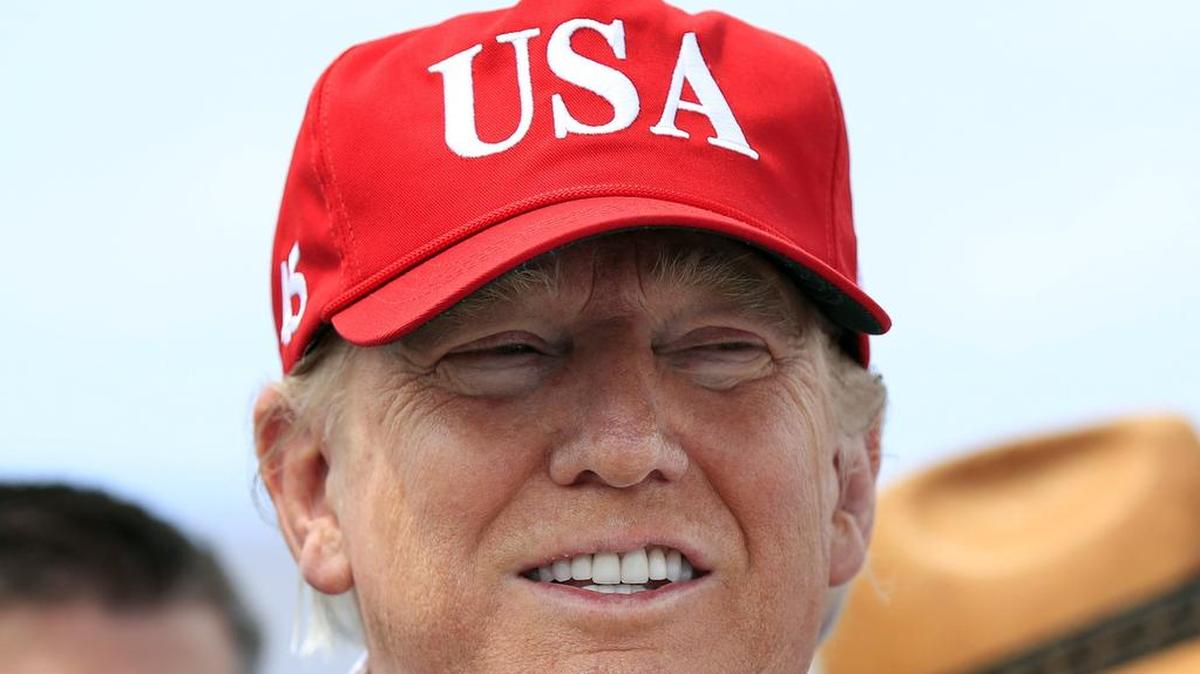 In this March 29, 2019 file photo, President Donald Trump speaks to reporters during a visit to Lake Okeechobee and Herbert Hoover Dike at Canal Point, Fla.
