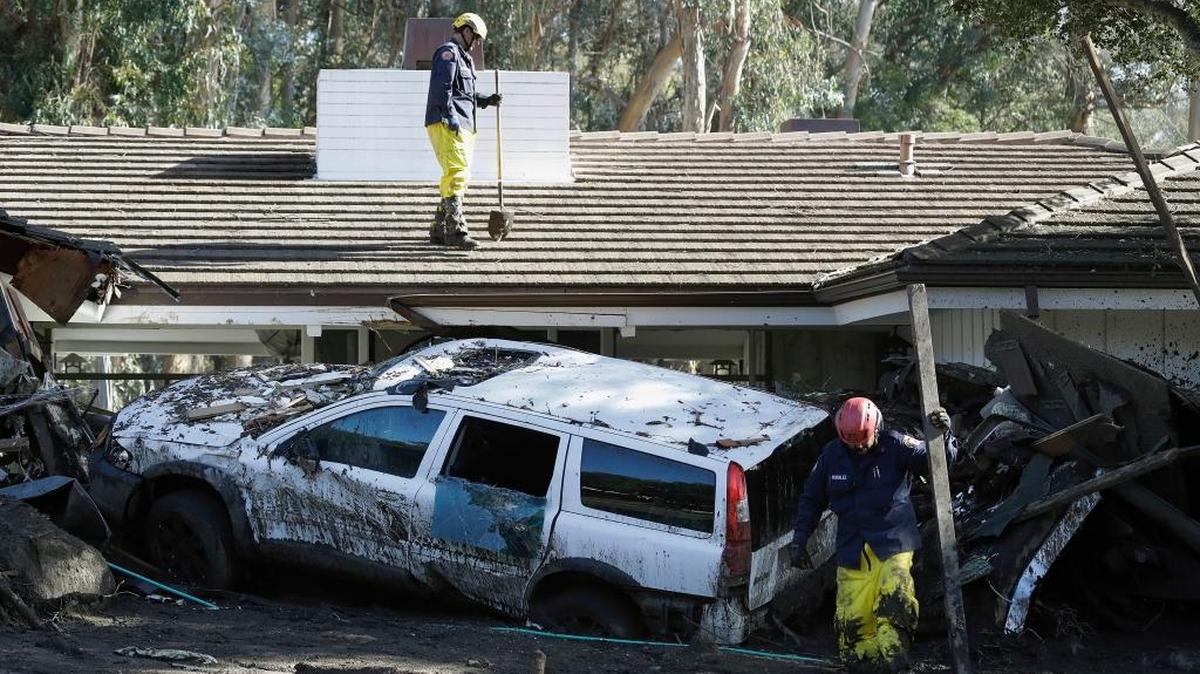 Emergency crew members search an area damaged by storms in Montecito Friday. The number of missing after a California mudslide has fluctuated wildly, due to shifting definitions, the inherent uncertainty that follows a natural disaster, and just plain human error.