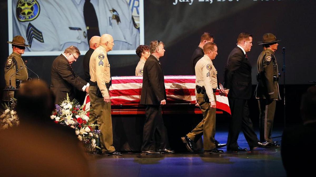 The flag-draped casket of Ventura County Sheriff’s Sgt. Ron Helus arrives on stage for a memorial service at Calvary Community Church in Westlake Village, Calif., Thursday, Nov. 15, 2018. Helus was one of twelve victims of the Borderline Bar & Grill mass shooting in Thousand Oaks.