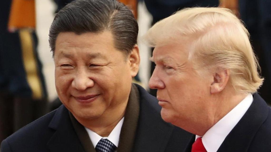 In this Nov. 9, 2017, photo, President Donald Trump and Chinese President Xi Jinping participate in a welcome ceremony at the Great Hall of the People in Beijing, China. Trump is to meet with Xi at the Group of 20 summit in Buenos Aires, Argentina, on Friday, Nov. 30, and Saturday, Dec. 1.