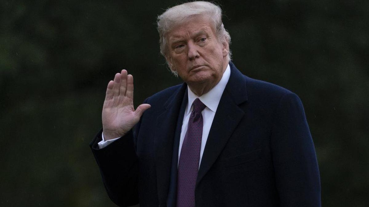 President Donald Trump waves as he walks from Marine One to the White House on Oct. 1, 2020.