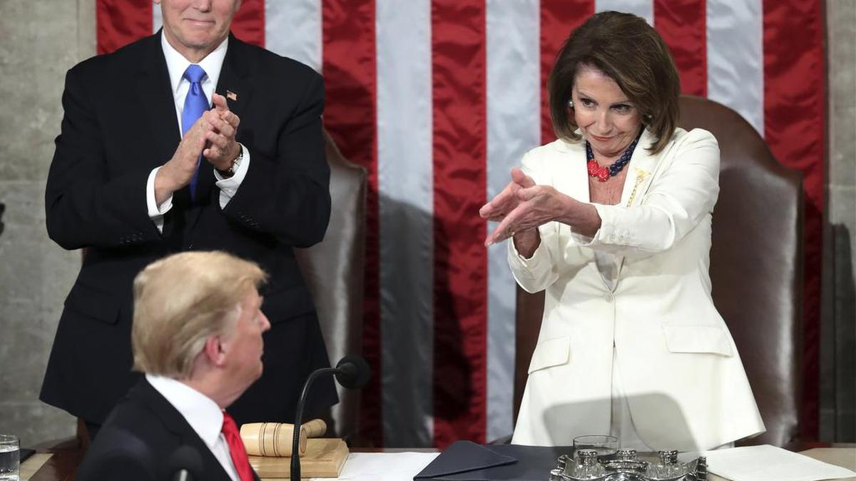 In this Feb. 5, 2019 file photo, President Donald Trump turns to House Speaker Nancy Pelosi of Calif., as he delivers his State of the Union address to a joint session of Congress on Capitol Hill in Washington while Vice President Mike Pence watches.