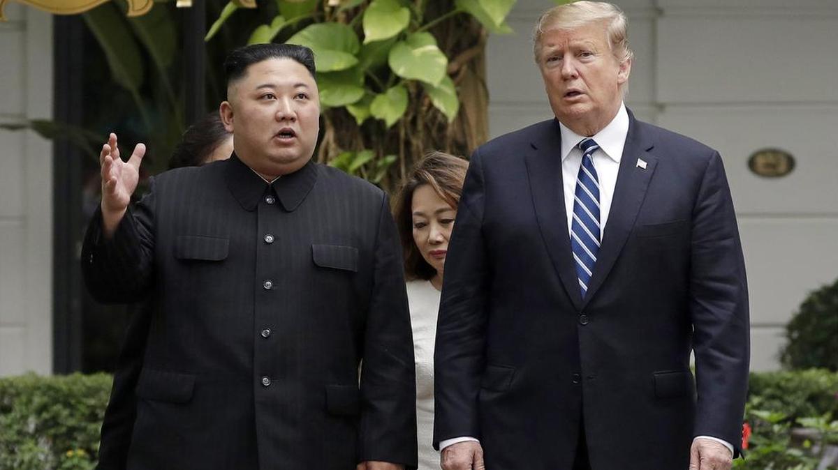 In this Feb. 28, 2019 photo, U.S President Donald Trump, right, and North Korean leader Kim Jong Un take a walk after their first meeting at the Sofitel Legend Metropole Hanoi hotel, in Hanoi, Vietnam. North Korea’s state TV on Wednesday, March 6, 2019, aired a documentary glorifying leader Kim’s recent visit to Vietnam that omitted the failed nuclear negotiations with Trump.