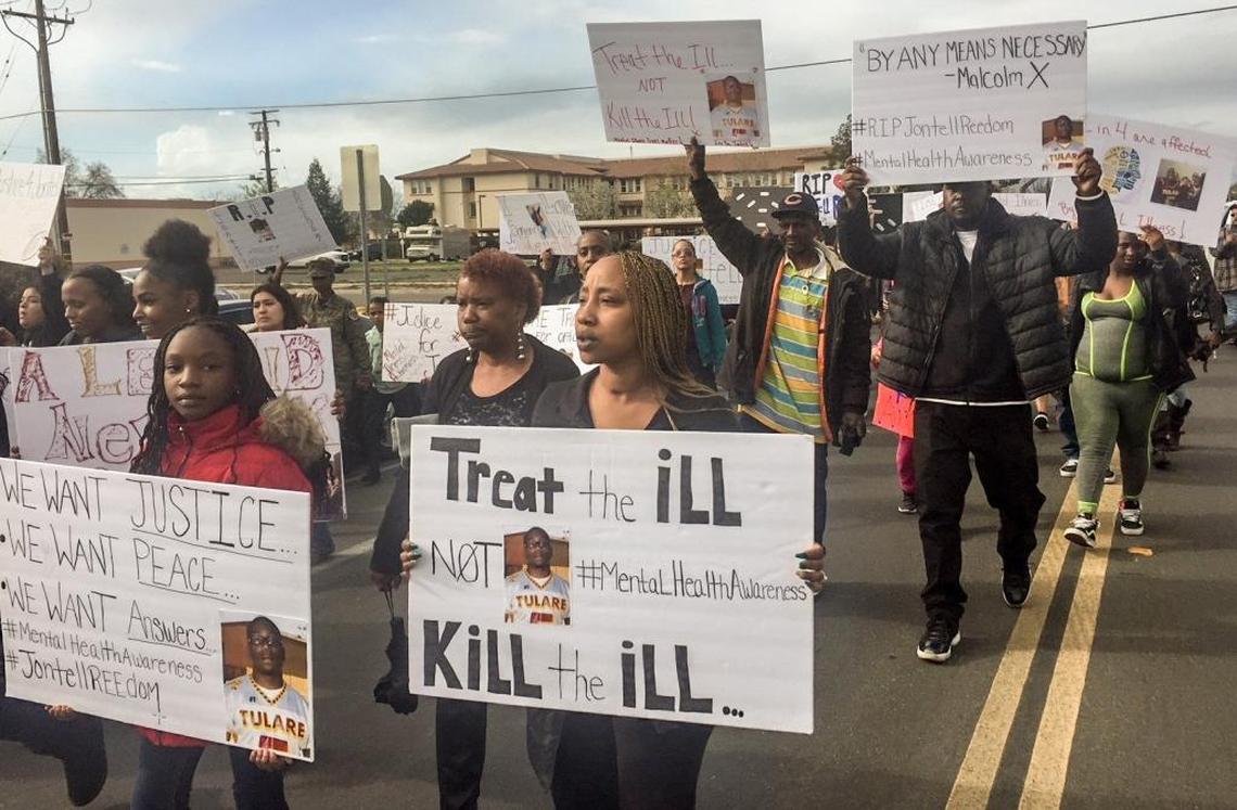 Marchers called for more resources to help the mentally ill during a protest Wednesday, March 14, 2018, in Tulare. The march followed the fatal police shooting of 27-year-old Jontell Reedom.