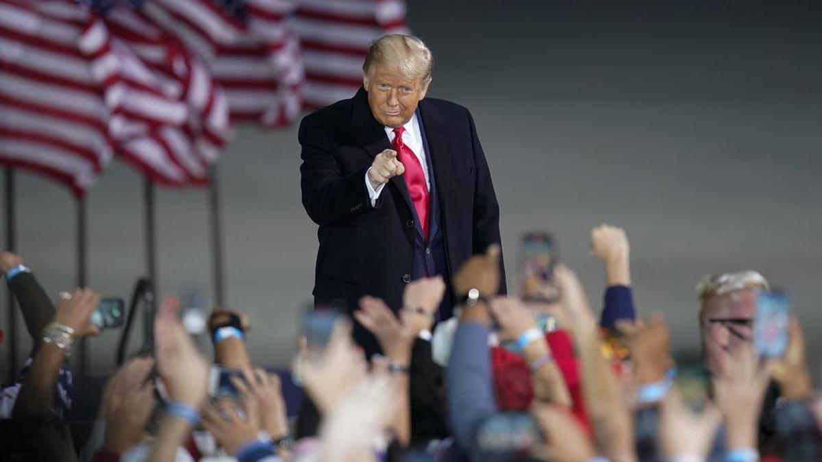 President Donald Trump arrives at a campaign rally at Des Moines International Airport, Wednesday, Oct. 14, 2020, in Des Moines, Iowa.