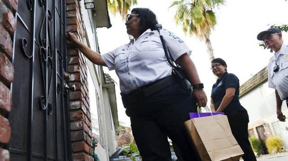 Volunteers from Citizens on Patrol join Fresno police officers from the Northwest Policing District to deliver turkey dinners to families on Tuesday in Fresno. Citizens on Patrol’s Mary Torres said a dozen families were selected for this inaugural year’s giveaway of donations.