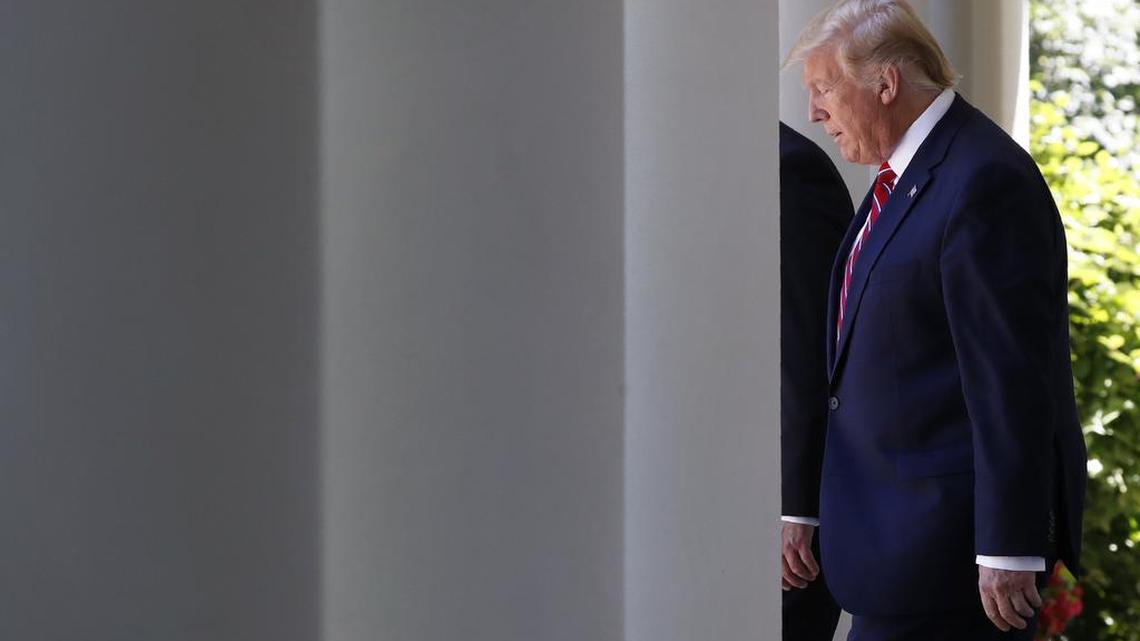 President Donald Trump walks through the Colonnade of the White House, next to Polish President Andrzej Duda, as they arrive for a news conference in the Rose Garden, Wednesday June 12, 2019, in Washington.