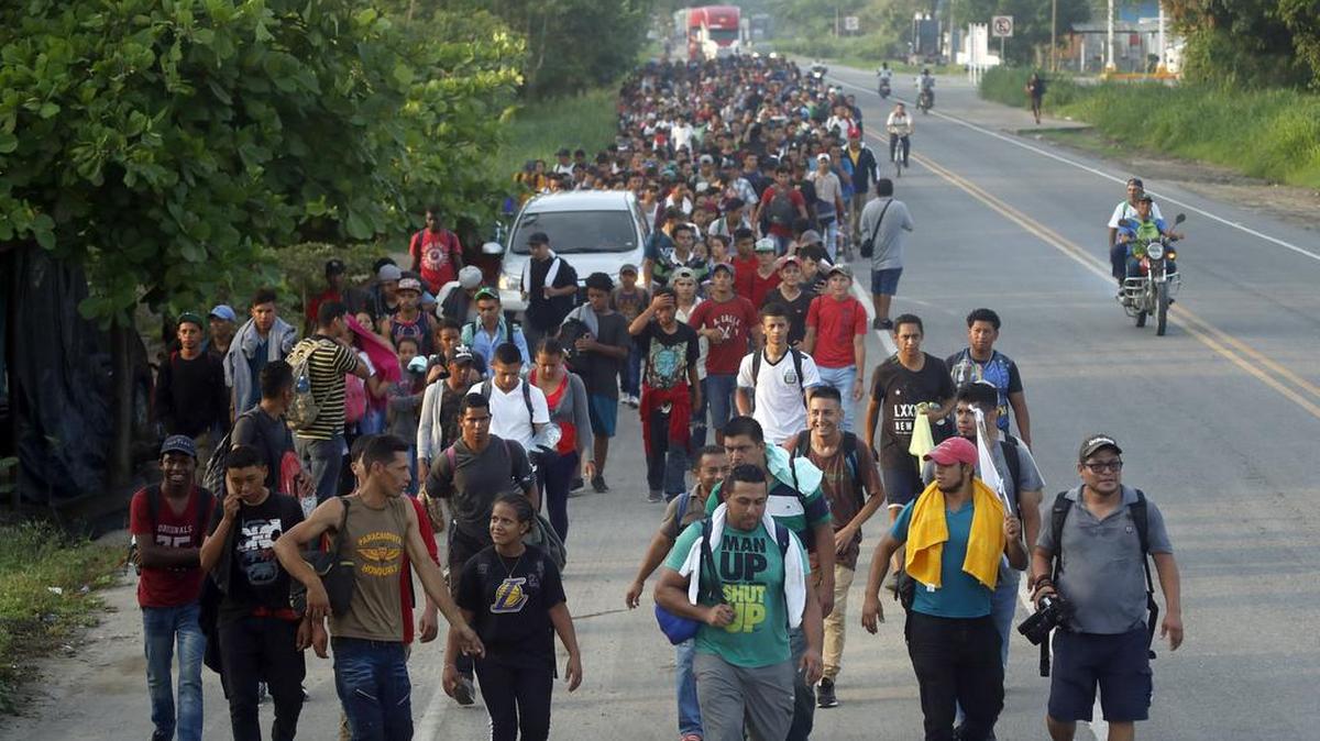 Hundreds of Central American migrants walk on the highway after crossing the Guatemala-Mexico border, near Ciudad Hidalgo, Mexico, Wednesday, June 5, 2019.