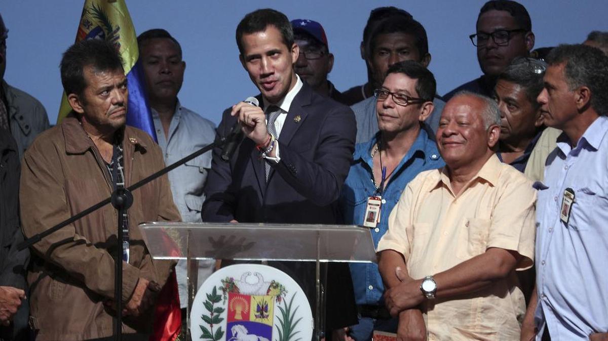 Venezuela's opposition leader and self proclaimed interim President Juan Guaido, center, speaks during a meeting with oil workers at the Metropolitan University of Caracas, Venezuela, Friday, May 3, 2019. The Trump administration ended a week of pointed but vague threats of a military response to the Venezuelan political crisis with a meeting at the Pentagon to consider its options, though there was still no sign any action was on the horizon.