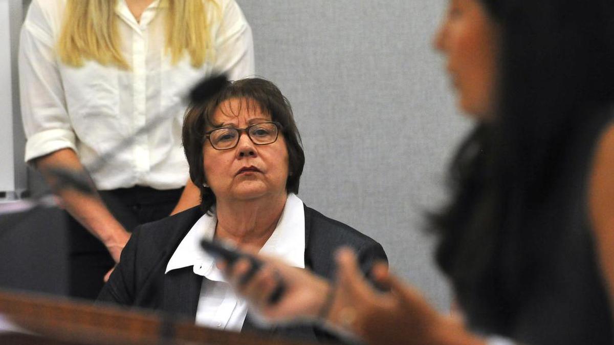 Fresno County Sheriff Margaret Mims listens to immigration rights attorney Maria Romani of the ACLU, Northern California, speak during the Board of Supervisors meeting, Tuesday Aug 8, 2018.