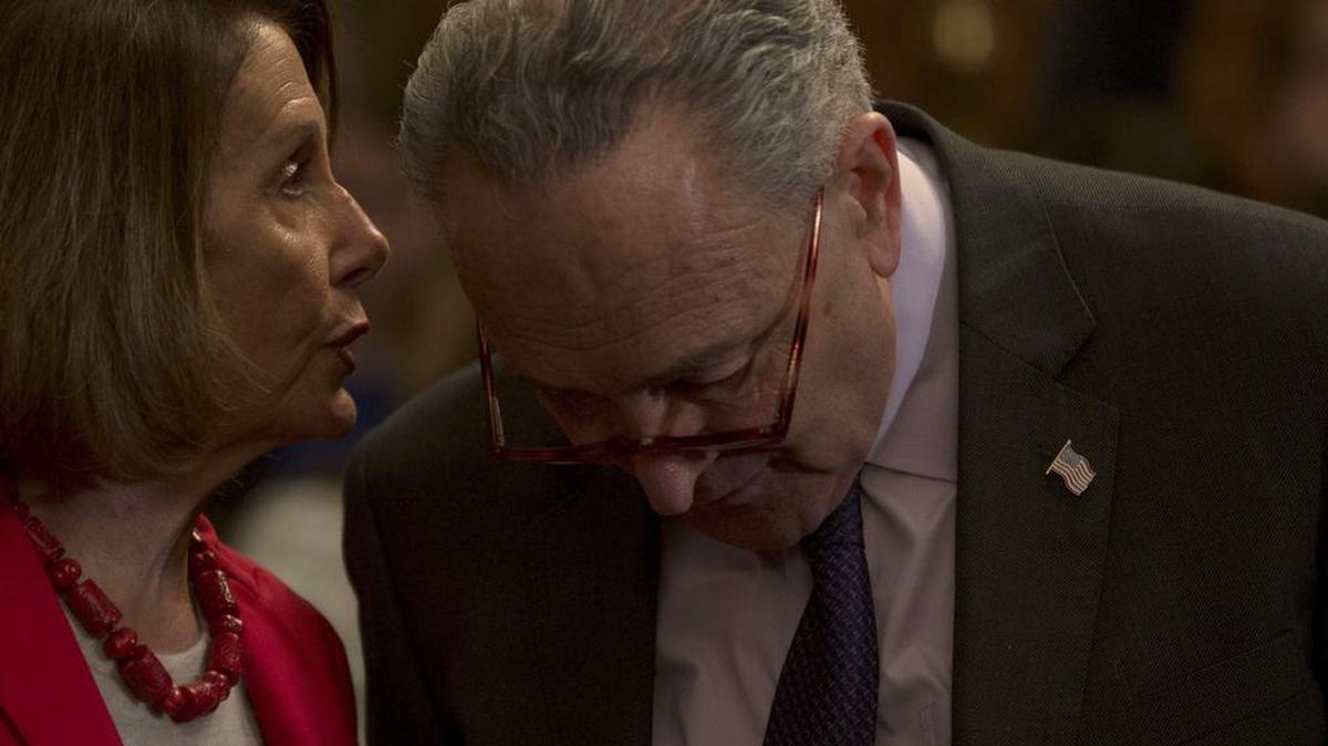 House Speaker Nancy Pelosi (D-San Francisco) and Senate Minority Leader Chuck Schumer (D-N.Y.) speak privately during the announcement of the Raise the Wage Act on Capitol Hill in Washington, Jan. 16, 2019.