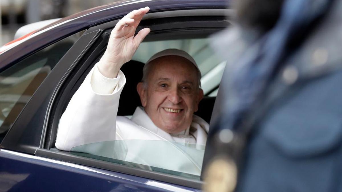 Pope Francis waves as he leaves after a private visit to the St. Mary Mayor Basilica in Rome, Dec. 8.
