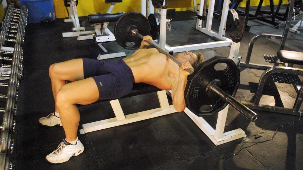 Michael Klepper demonstrates the bench press on a decline bench at Medfit gym in Miami.