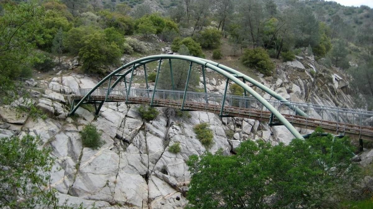 This steel and wooden footbridge spans the San Joaquin River, providing access to hiking trails on the Madera County side of the San Joaquin River Gorge outside Auberry. The gorge contains about 7,000 acres of public lands between Millerton Lake and Kerckhoff Reservoir.