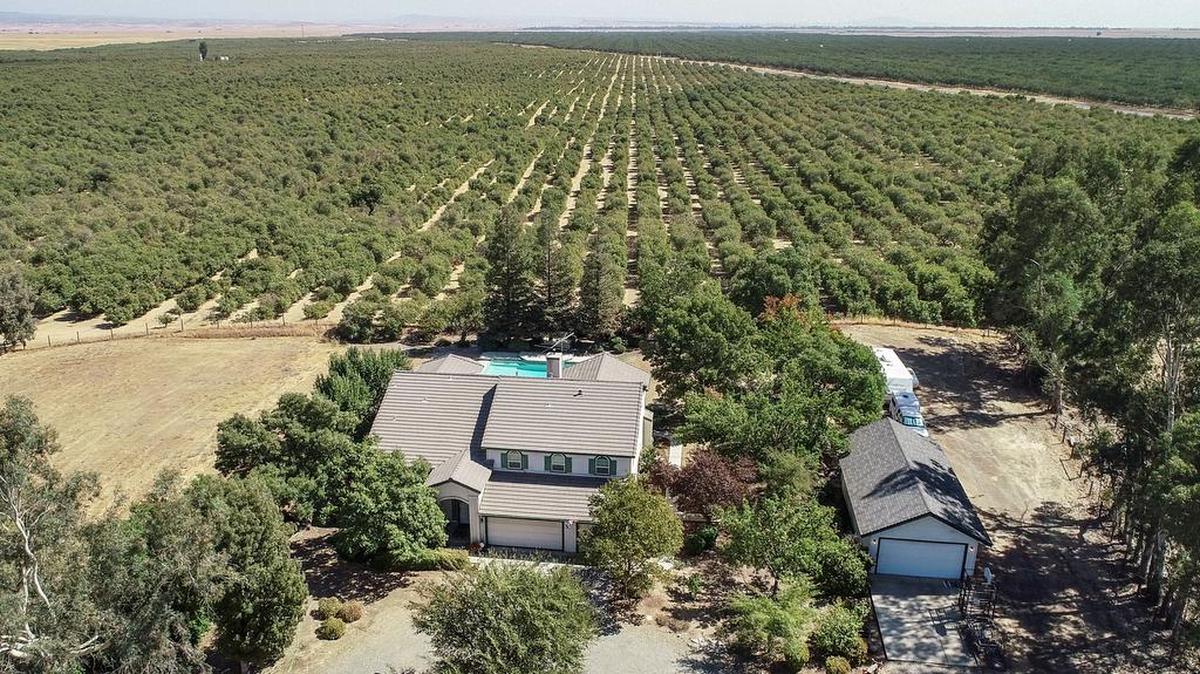 A couple built their home on grazing land in Madera County during the 1990s to raise their kids and retire. Later farms began growing trees around the area. Now concerns are that homes are pushing out into what was farming land.