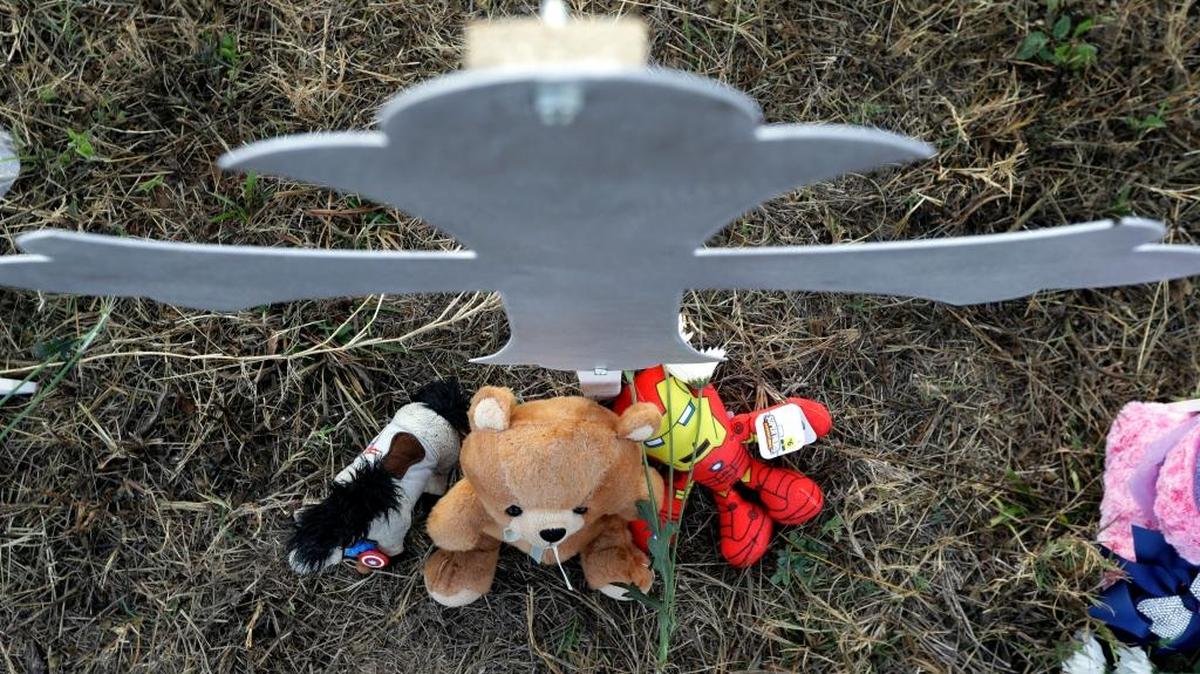 Stuffed animals sit at the base of a cross at a makeshift memorial for victims near the scene of a shooting at the First Baptist Church of Sutherland Springs, Tuesday, in Texas. A man opened fire inside the church in the small South Texas community on Sunday, killing more than two dozen and injuring others. Vince Marrone writes that he suspects the cause to be “evil.”