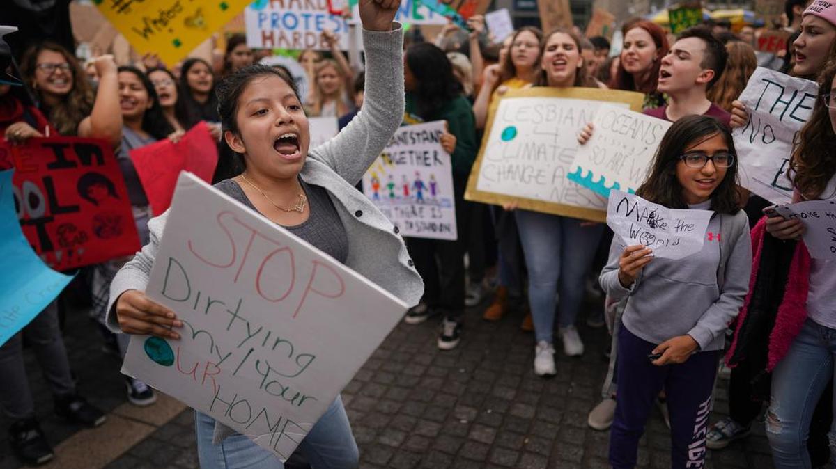 Demonstrators call for action on climate change at Columbus Circle in Manhattan, March 15, 2019. Children and young adults around the world skipped school en masse on that Friday to demand action on climate change.